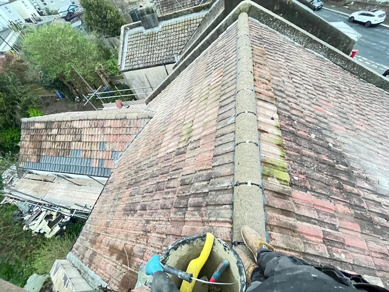 Professional dry ridge system installation on a tiled roof by First Choice Roofing Kent.